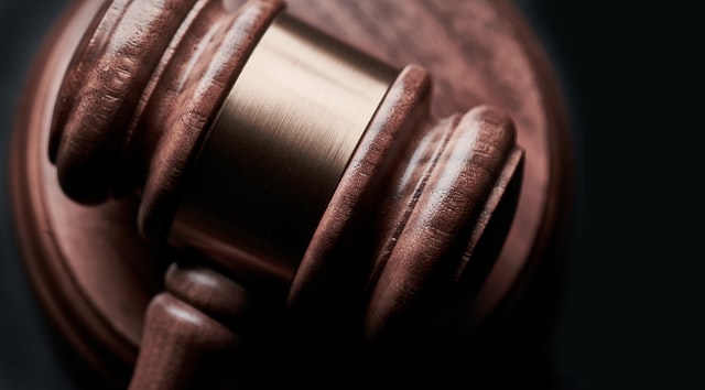 a brown wooden judges gavel