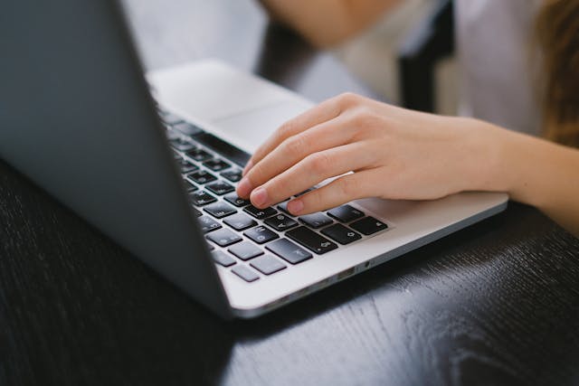 a person typing on a computer